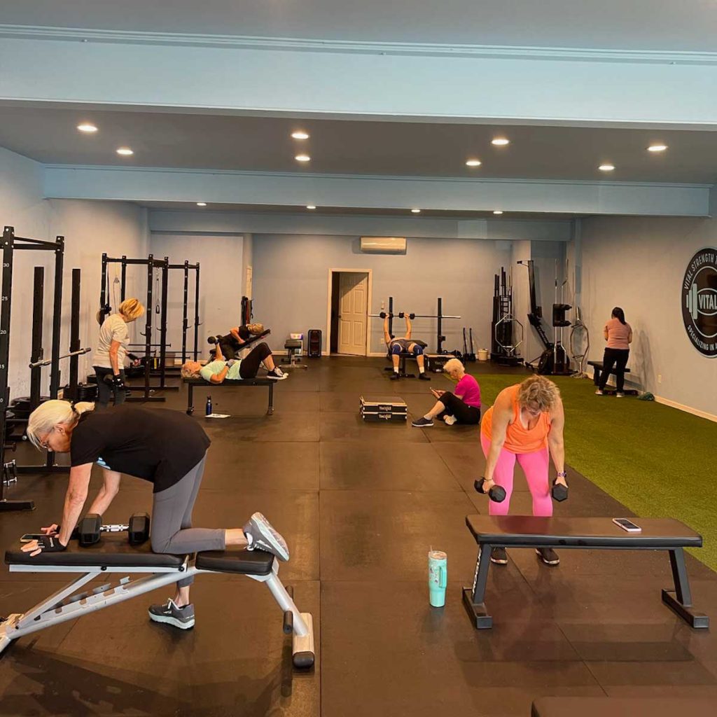 The Thrive Group Strength Training gym, bustling with members working out