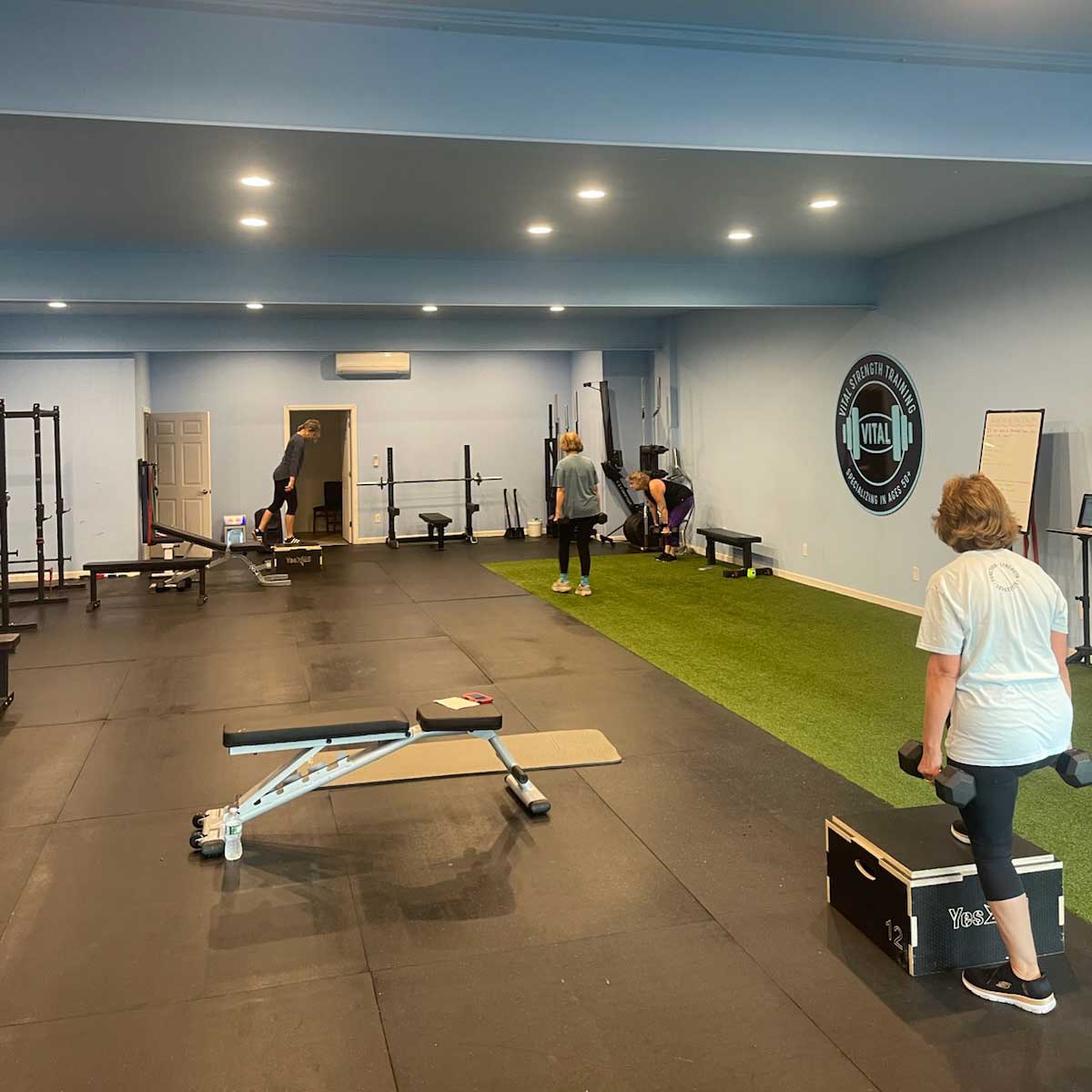 Several Thrive Group Strength Training gym members working out